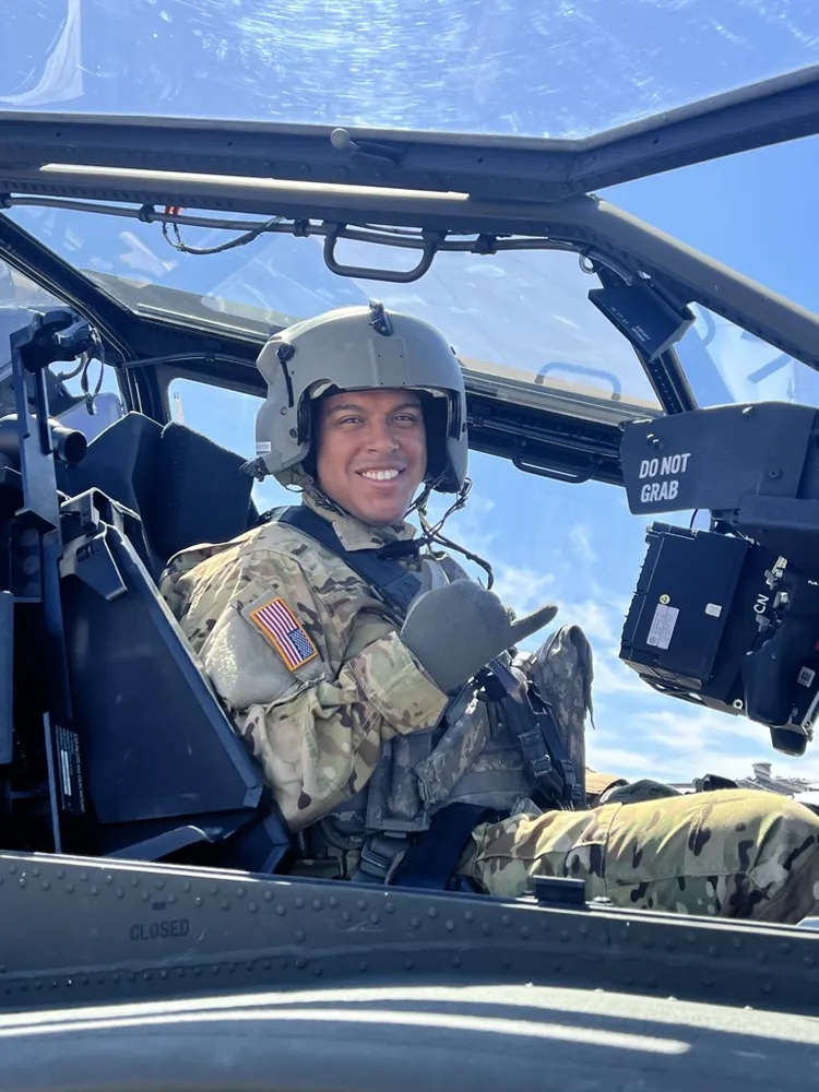 Robert Solano smiling in a helicopter cockpit