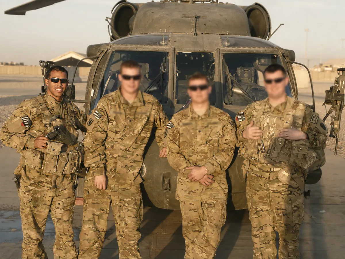 Robert-Solano-Veteran-1200 Robert Solano with his Black Hawk crew in front of a UH-60 helicopter